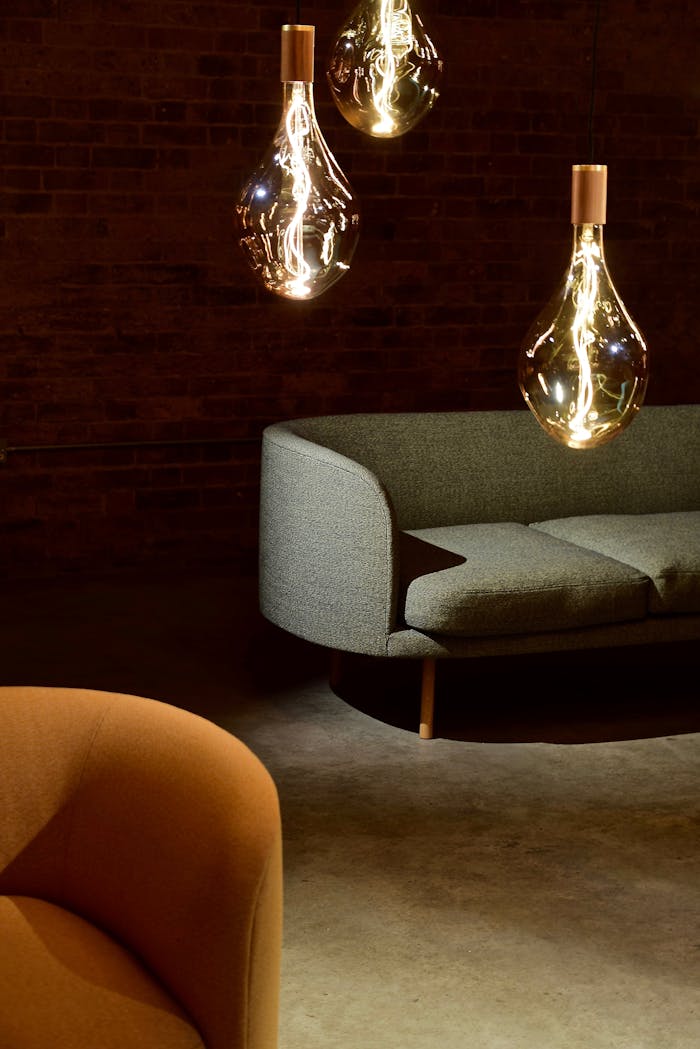 home-hero Elegant modern living room with designer lighting and minimalistic furniture.